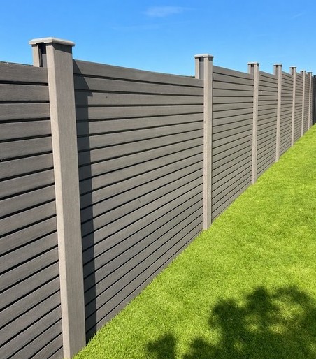 dark-grey-newly-installed-composite-fencing-in-back-garden