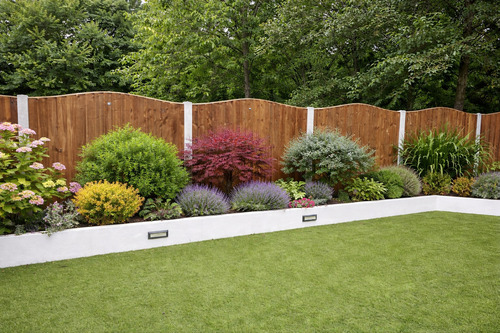 wooden-fencing-in-back-garden-with-flowers-in-front