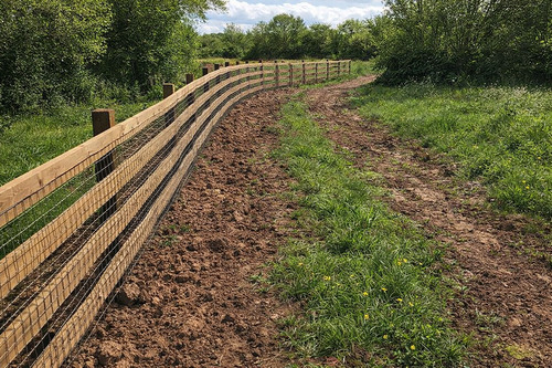 long-wooden-fencing-in-rural-land